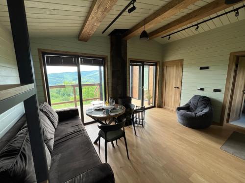 a living room with a couch and a table at Kosuli in Oriv