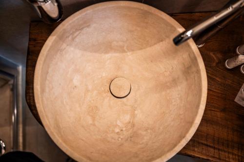 a large wooden pot with a circle on it at Domus Nursia in Norcia