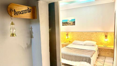 a small bedroom with a bed in a room at Casa Piauí Hostel in Teresina