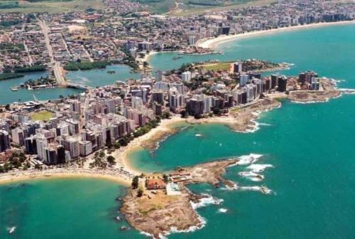 an aerial view of a city and the ocean at Casa Pé na Areia 027 QUARTO CASAL 1 in Guarapari
