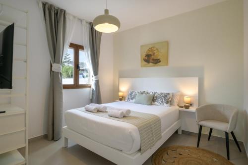 Ένα ή περισσότερα κρεβάτια σε δωμάτιο στο Suites Bene LANZAROTE