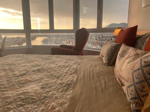 a bedroom with a bed with a view of a city at Laredo Ocean Port in Laredo