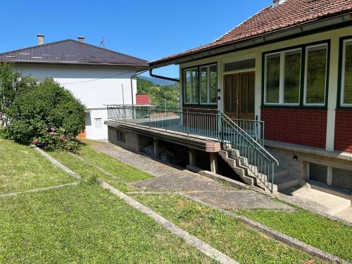 a house with a porch with a ramp on it at Nostalgia apartments in Jajce