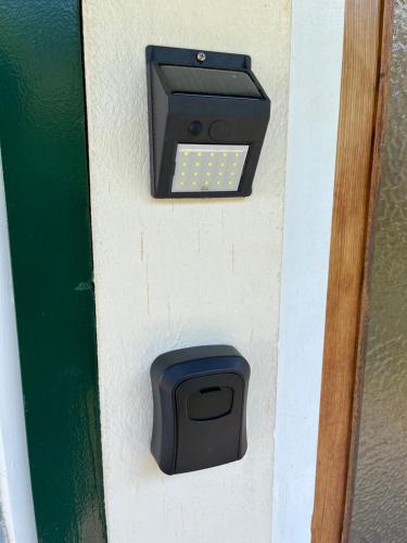 a pay meter on a wall with a mailbox at Nostalgia apartments in Jajce