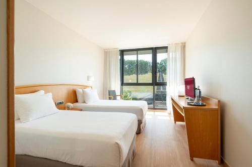 A bed or beds in a room at Exe Area Central