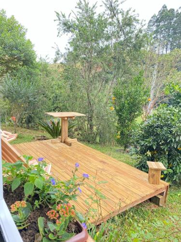 a wooden deck in the middle of a garden at Cabana in Annitapolis