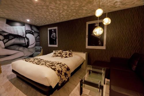 Postel nebo postele na pokoji v ubytování Asahikawa Hotel UNION-Adult Only