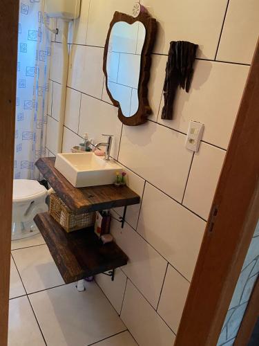 a bathroom with a sink and a mirror on the wall at Cabana in Annitapolis