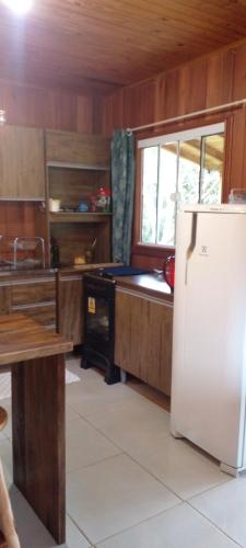 a kitchen with a refrigerator and a table in it at Cabana in Annitapolis