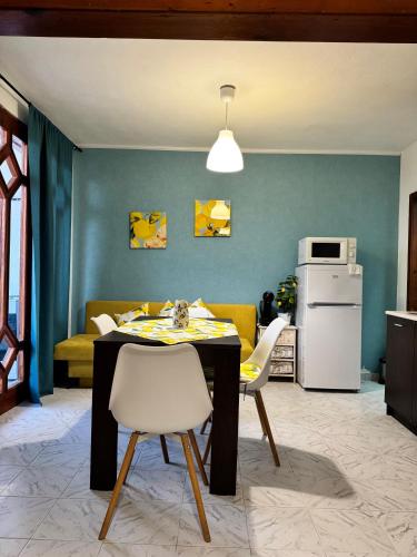 a kitchen and living room with a table and chairs at Villa Nikoleta in Sveti Vlas