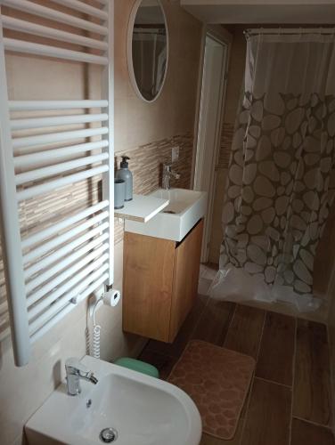 a bathroom with a sink and a shower at Vi & Vi relax by the lake in Montorfano