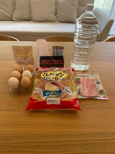 a table with some food and a bottle of water at Niseko STREAM Villas in Rankoshi
