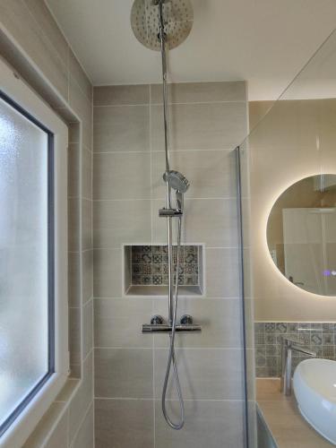 a bathroom with a shower and a sink at Appartement Confort Cholet in Cholet