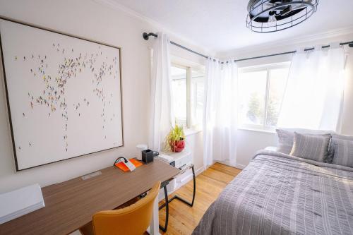 a bedroom with a desk and a bed and a window at Oscawana Lake Escape in Putnam Valley