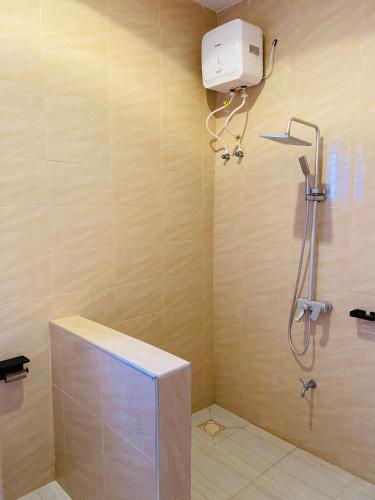 a shower stall in a bathroom with a shower at One bedroom Dodoma in Dodoma