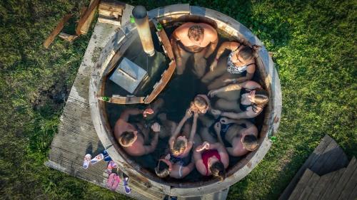 an overhead view of a group of people in a pool at Transylvania Undiscovered 