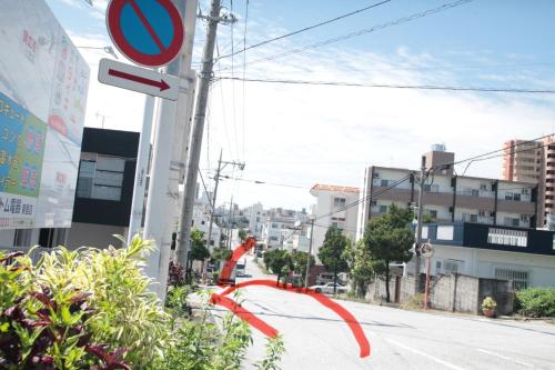 a street with a red ribbon tied to a pole at 2F - Vacation STAY 41649v in Okinawa City