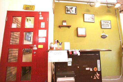 a room with a red door next to a counter at 2F - Vacation STAY 41649v in Okinawa City