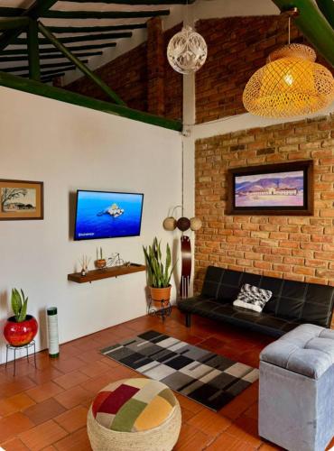 TV a/nebo společenská místnost v ubytování Villa San Carlos-Casa familiar con amplio Jardín