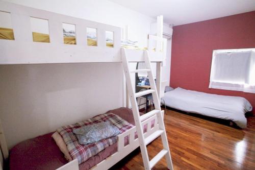 a room with two bunk beds and a bed at 2F - Vacation STAY 41669v in Okinawa City