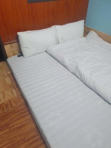 Ένα ή περισσότερα κρεβάτια σε δωμάτιο στο Hà Châu Homestay