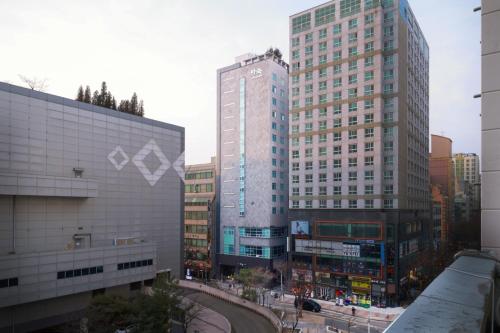 a group of tall buildings in a city at Aank Hotel Incheon Guwol in Incheon