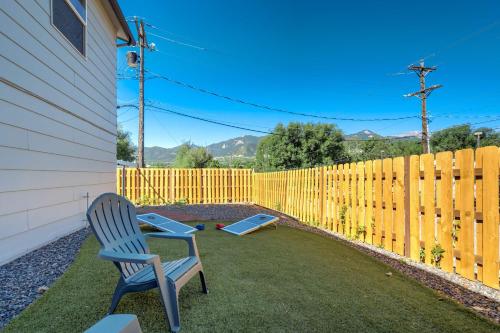 a yard with a chair and a fence at Vermijo Flat Walk to Downtown Shops & Dining in Colorado Springs