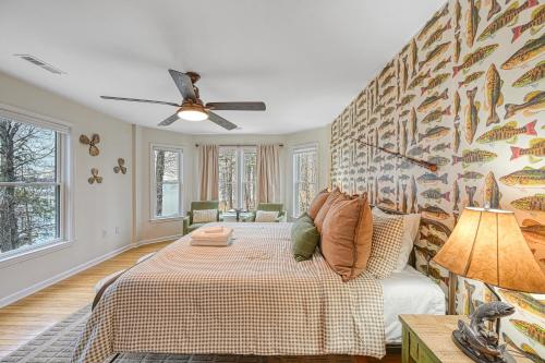 a bedroom with a bed and a ceiling fan at Lka Luxury Sandy Beach, Sauna, Hot Tub, Firepit in Bumpass