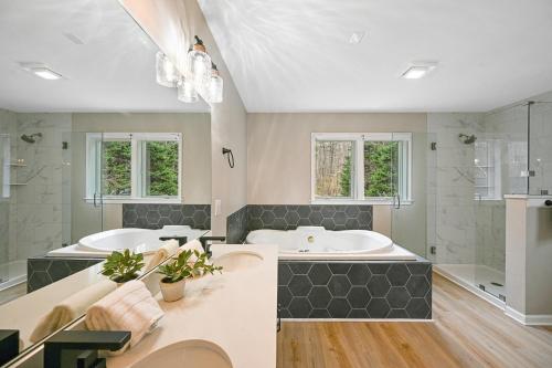 a large bathroom with two sinks and a tub at Lka Luxury Sandy Beach, Sauna, Hot Tub, Firepit in Bumpass