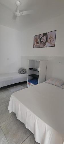 Katil atau katil-katil dalam bilik di Apartamento Triplo Central