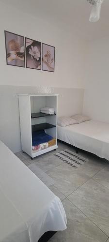 Postel nebo postele na pokoji v ubytování Apartamento Triplo Central