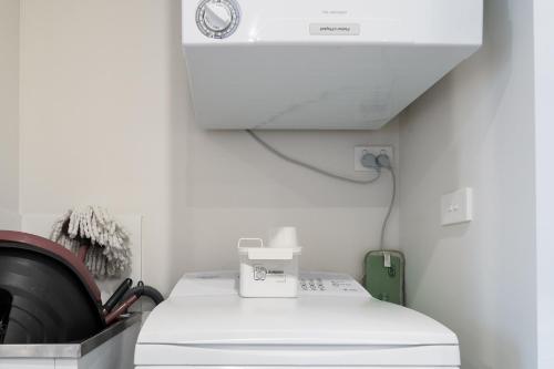 a laboratory room with a microscope and a machine at Convenient City Apartment in the Heart of Braddon - Hosted by Canstay in Braddon