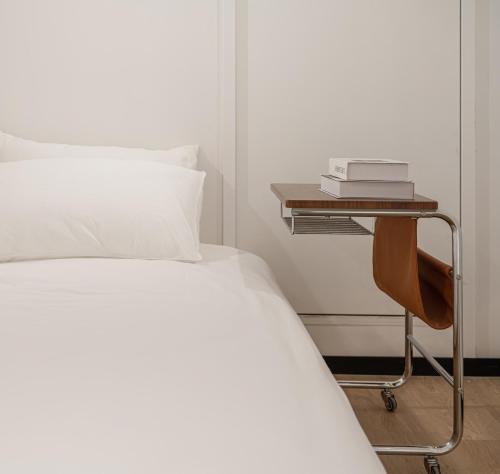 Postel nebo postele na pokoji v ubytování Plus House Serviced Apartment