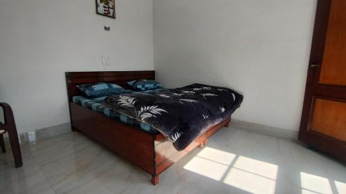 a bed with two pillows on it in a room at Hatu View Homestay in Nārkanda
