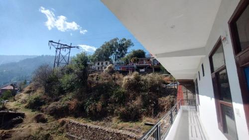 a view from the balcony of a house at Hatu View Homestay in Nārkanda