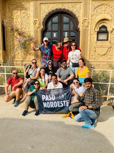 a group of people posing for a picture in front of a building at Hotel Tokyo Palace in Jaisalmer