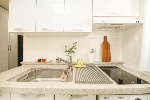 a kitchen with a sink and a counter top at Urban Nest Cozy Studio near Konkuk in Seoul