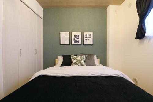 Postel nebo postele na pokoji v ubytování フォルモント寺田町 202