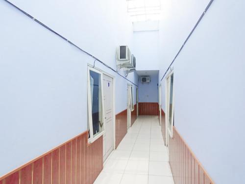 an empty corridor in a hospital building at RedDoorz at Griya Jeniee Near Stadion Wilis Madiun in Madiun