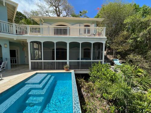 an image of a house with a swimming pool at Tropical Pool Villa with Big Views and Lush Gardens in Coral Bay