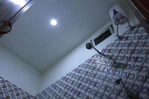 a view of a room with a ceiling and a window at Hotelswapnoneer in Diamond Harbour