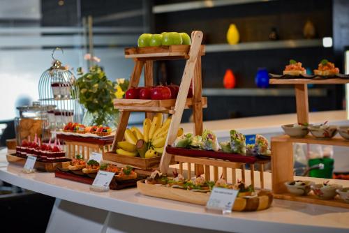 a display of fruits and vegetables on a table at Holiday Inn Bangkok Sukhumvit by IHG in Bangkok