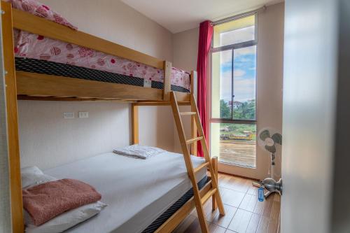 a bedroom with two bunk beds and a window at Top Rated Apartment with Parking and Full Comfort in Tarapoto