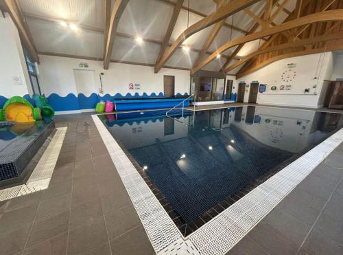 a indoor swimming pool with a pool at The Rainbow's nest in Morecambe