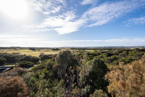 a view of a golf course in the middle of a forest at Hopewell House with Spa and Golf Course Views in Saint Andrews Beach