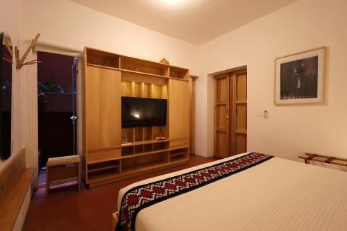 Ein Bett oder Betten in einem Zimmer der Unterkunft Hotel Ayook