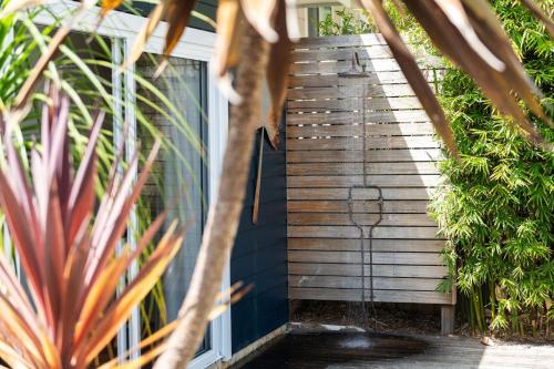 a set of wooden stairs leading up to a house at The Manyana Getaway in Manyana