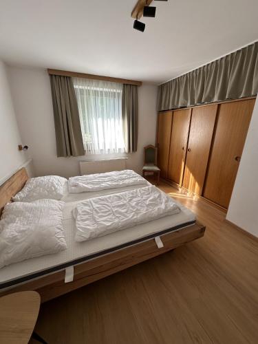 a bedroom with a large bed in a room at House Egger - Top 202 in Bad Kleinkirchheim