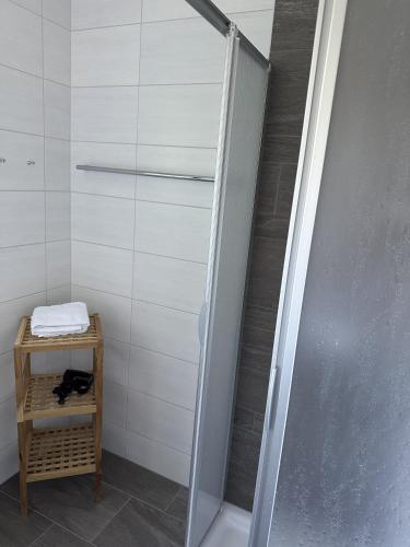 a shower with a glass door in a bathroom at House Egger - Top 202 in Bad Kleinkirchheim
