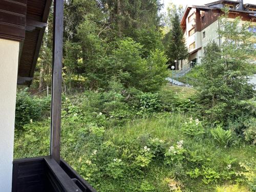 a view of a yard from a window of a house at House Egger - Top 202 in Bad Kleinkirchheim